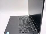 a laptop that is sitting on a white table