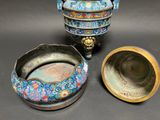 two bowls and a bowl sitting on a table