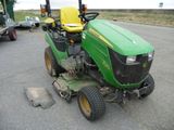 a picture of a tractor parked in a parking lot