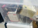 a plastic box with a lot of items inside of it
