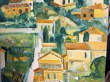 a painting of a village on a easel in a room