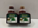 two bottles of aloefes sitting on top of a counter