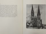 an open book with a picture of a church on it