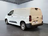 a white van that is parked in a room