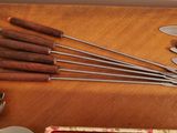 many different types of kitchen utensils on the table