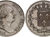 a silver coin with a crown on top of it