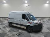 an image of a white van parked in a room