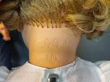 a doll that has a haircut on it