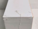 a close up of a piece of wood that has been painted white