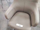a chair that is sitting in a lot with a price tag on it