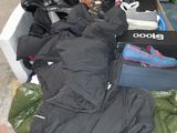 a pile of clothing and shoes on the ground