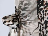 a picture of a woman wearing a leopard print dress