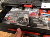 a person holding a tool box with tools in it