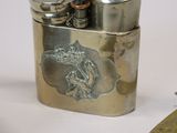 a silver lighter with a picture of a horse on it