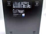the back of a laptop with a battery on top of it