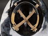 a close up of a helmet with a cross on it