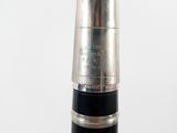 a close up of a silver and black fountain pen