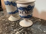 two cups that are sitting on a table