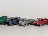 a lot of toy trains that are lined up on the table
