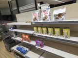 many shelves in a grocery store that have food items on them