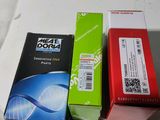 three boxes of toothpaste sitting on a table