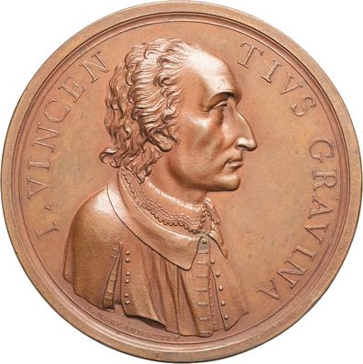 an image of a bronze medal of a man with a beard