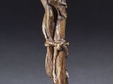 pair of bronze figurines of a woman and a bird