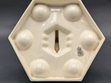 an image of a white vase with a hole in the middle