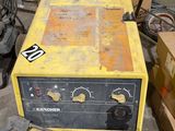 a yellow machine that is sitting in a room