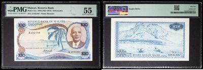 two pieces of paper money with a picture of a mountain in the background