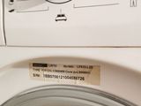a close up of a washing machine with a label on it
