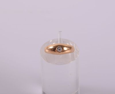 a clear glass with a gold ring on top of it