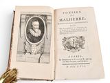 an open book with a picture of a man and a dog on it