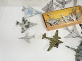 a lot of toy airplanes that are sitting on a table