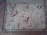 a metal plate with a map on it on the floor