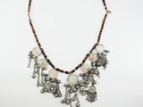 the necklace is made of silver and brown beads
