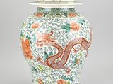 an image of a vase with a dragon and flowers on it