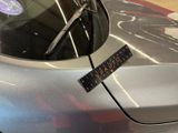 a sticker on the hood of a car that has a sticker on it