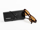 a pair of sunglasses sitting on top of a black case
