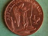 an image of a penny that is sitting on a green surface