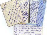 several pieces of paper with writing on them sitting next to each other
