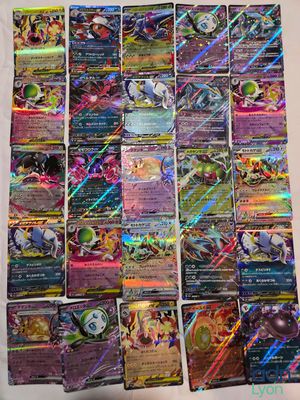 a pile of pokemon cards sitting on top of a table