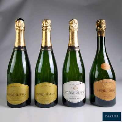 three bottles of champagne sitting next to each other on a table
