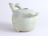 a small blue vase with a bird on it