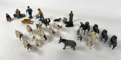 many figurines of people and animals in the snow