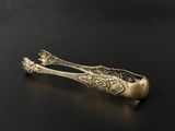 a close up of a spoon on a table with a black background