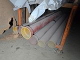 a pile of pipes sitting in the corner of a room