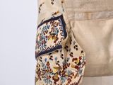 a close up of a woman ' s waist with a purse on it
