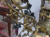 a table with a vase on it and a lamp on top of it
