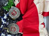 a picture of a box with a red dress and some silver coins